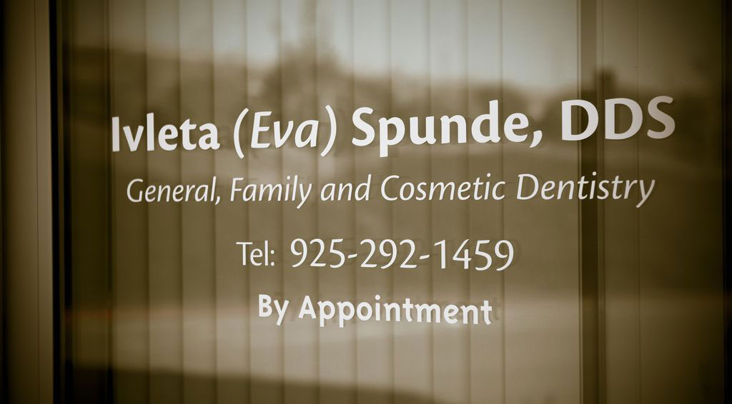 The image shows a sign with text that reads  Ivetta Spunde, DDS,  indicating that this is a dental practice named after Ivetta Spunde who holds a Doctor of Dental Surgery  DDS  degree.