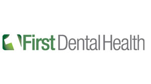 The image features a logo with text that reads  First Dental Health  alongside a graphic element resembling a stylized letter  D  within a circular frame, set against a grey background.